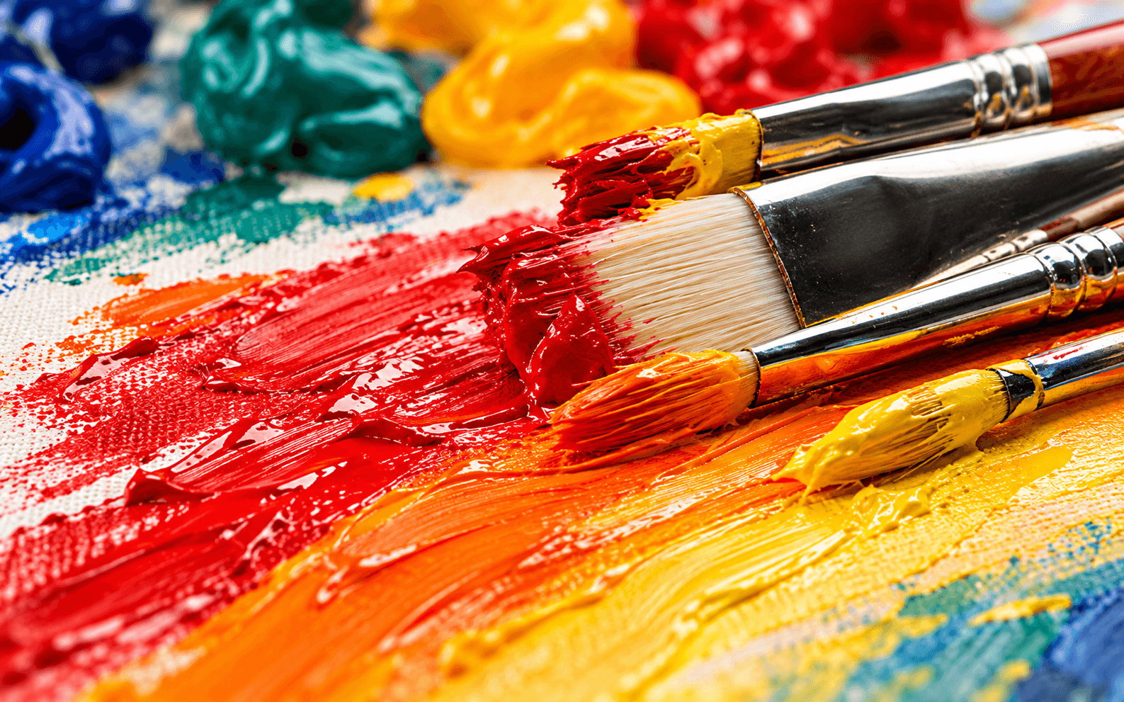 Paint brushes and thick strokes of bright wet paint